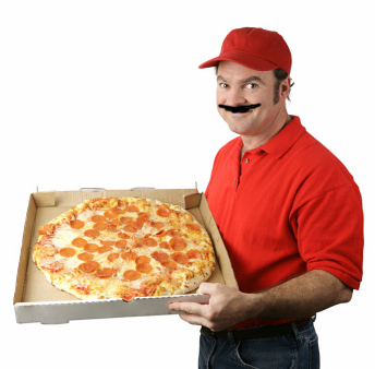 Pizza delivery man holding a pizza
