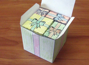 A large paper box filled with smaller rectangular and cubic paper boxes.