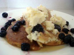 Pancakes with ice cream and blueberries.