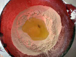 Flour and egg in a mixing bowl.