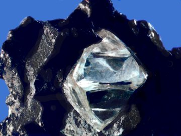 A rock containing a diamond.