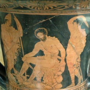 An ancient Greek jug with a picture of a man sitting, surrounded by others.