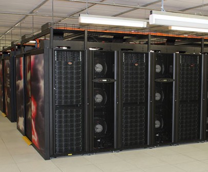 The Raijin supercomputer - rows of black computer processors in a large room.
