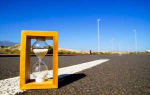 A sand timer on a road.