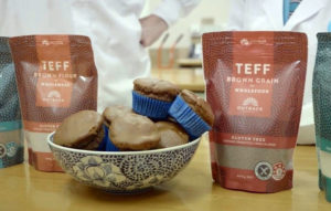 Image of a bowl of muffins and some bags labeled Teff