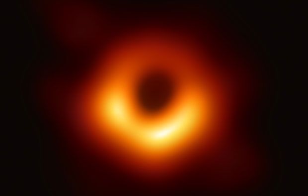 Glowing red and orange donut shape on a black background.