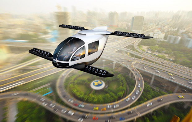 Artists impression of a flying car above a city scape.