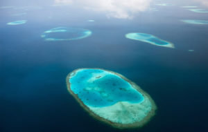 Aerial photo of an atoll reef .
